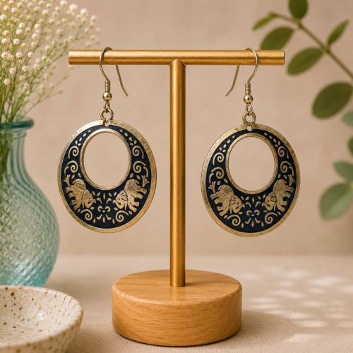 Earrings round black with gold coloured elephants