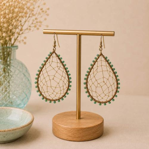 Earrings teardrop gold colour web with green bead edging
