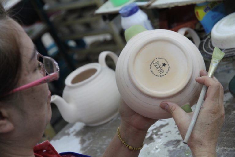 Teapot being painted
