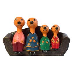 Meerkat family of 4 on sofa hand-carved from Albesia wood