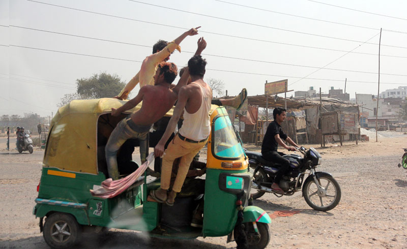 (At least) four in a tuktuk during Holi!