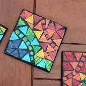 Set of 4 rainbow mosaic coasters in holder
