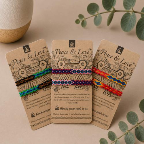 2 friendship bracelets on a card, peace & love, colours will vary
