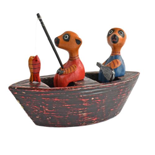 2 Meerkats in a boat hand carved from Albesia wood, 18 x 10 x 5cm