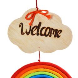 Rainbow hanging with 'Welcome' sign