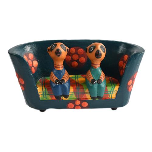 2 Meerkats in a floral sofa hand carved from Albesia wood,15 x 8 x 4cm 