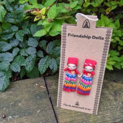 Friendship dolls holding hands on card
